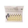 Coffret BABOR Nutri Restore ouvert avec sept ampoules jaunes, ouvre-ampoule et mode d'emploi