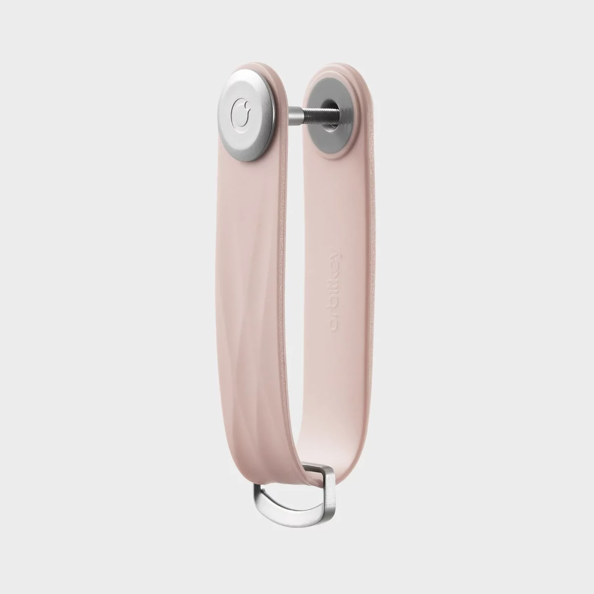 Vue de profil du porte-clés Orbitkey « Aktiv » en rose pâle, vierge, avec vis de fixation et anneau en D
