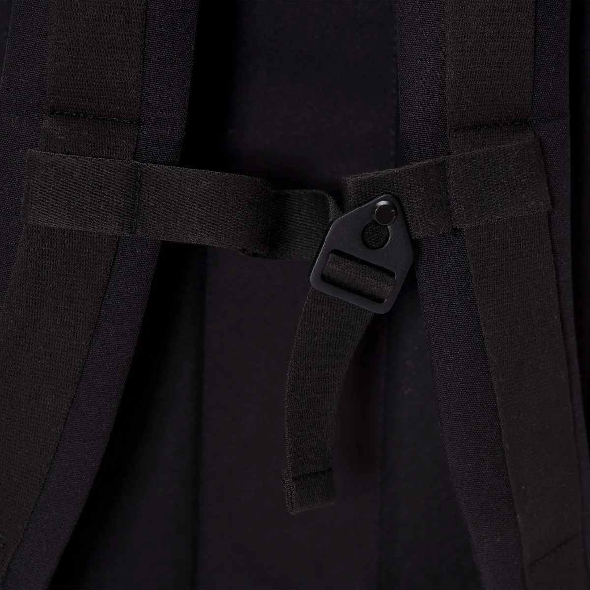 Close-up of the adjustable chest strap and buckle on the Ucon Acrobatics Hajo Pro backpack in dark navy