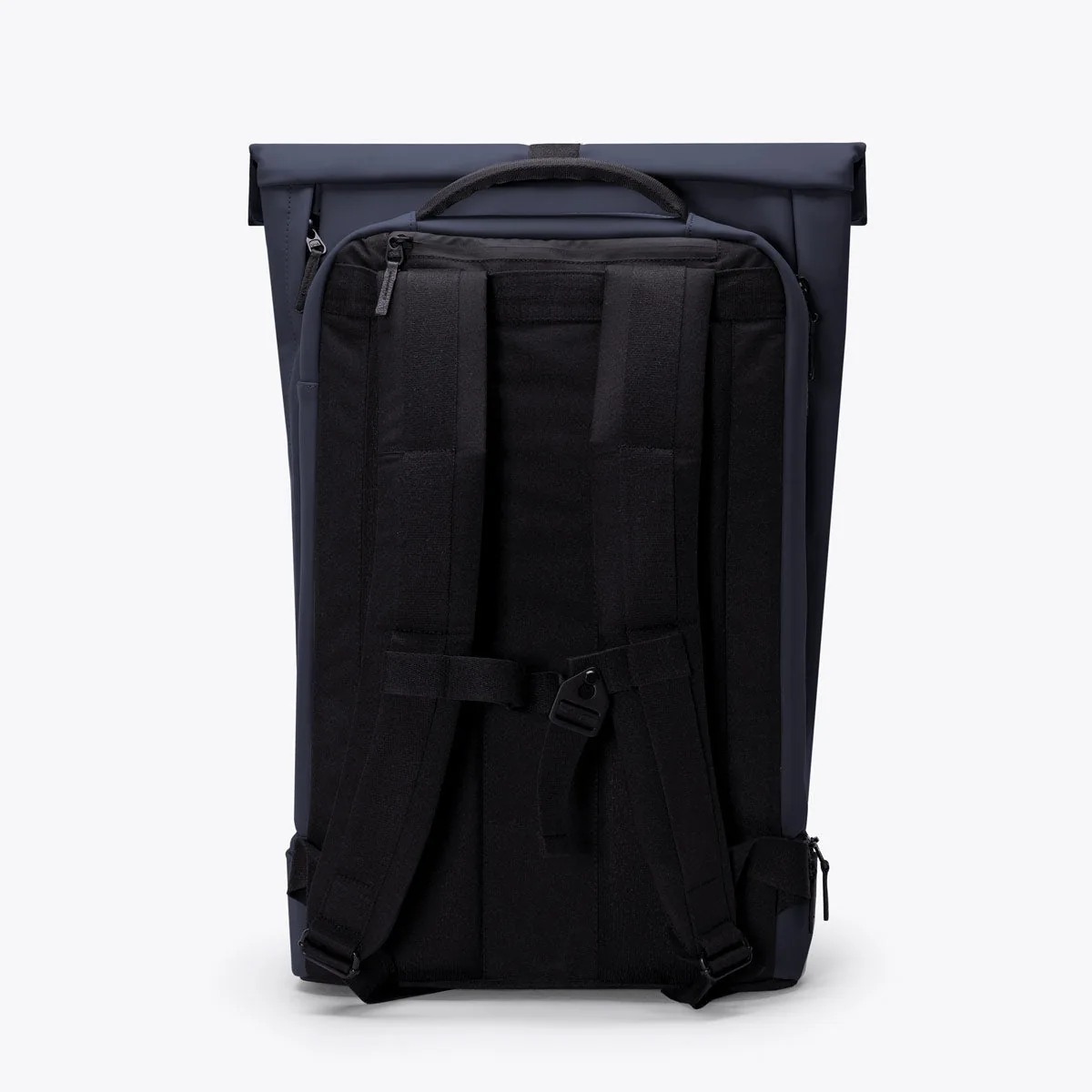 Back of the Ucon Acrobatics Hajo Pro backpack in dark navy showing the padded back panel, shoulder straps and chest strap