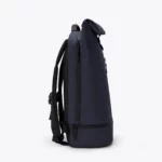 Right side view of the Ucon Acrobatics Hajo Pro backpack in dark navy with the side zip into the main compartment