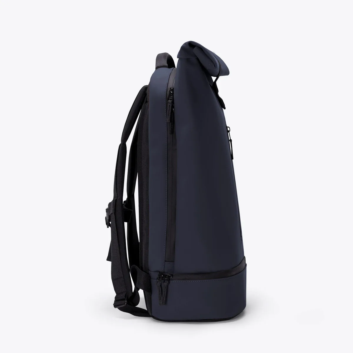 Right side view of the Ucon Acrobatics Hajo Pro backpack in dark navy with the side zip into the main compartment