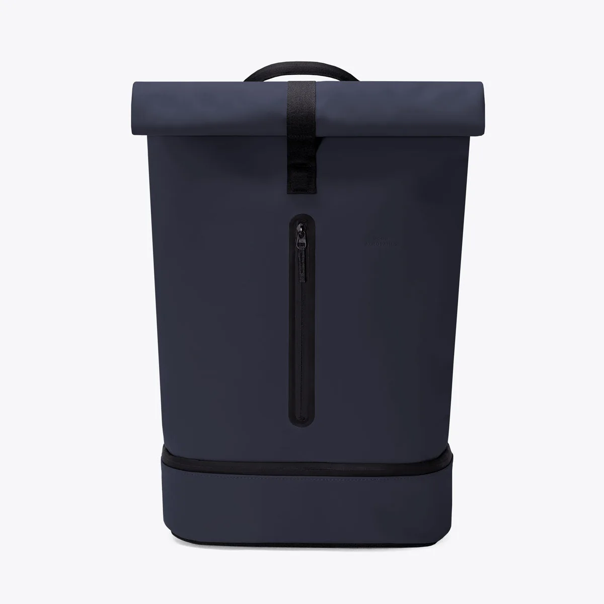 Front view of the Ucon Acrobatics Hajo Pro roll-top backpack in dark navy with the vertical zip of the front pocket
