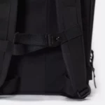 Close-up of the adjustable chest strap and buckle on the Ucon Acrobatics Hajo Pro backpack in black