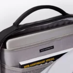 Inside the main compartment of the Ucon Acrobatics Hajo Pro backpack in black with laptop sleeve and brand label