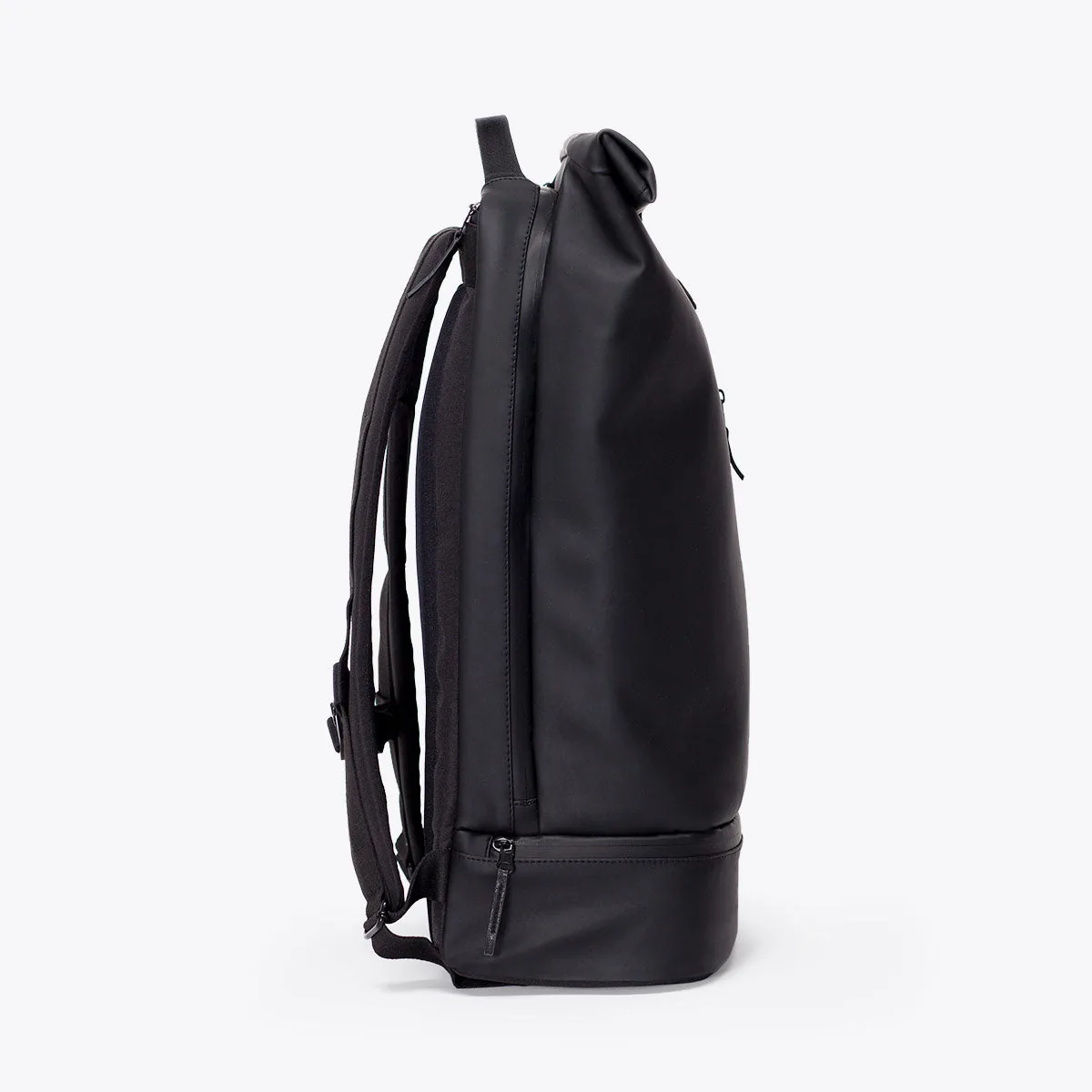 Right side view of the Ucon Acrobatics Hajo Pro backpack in black with the side zip into the main compartment