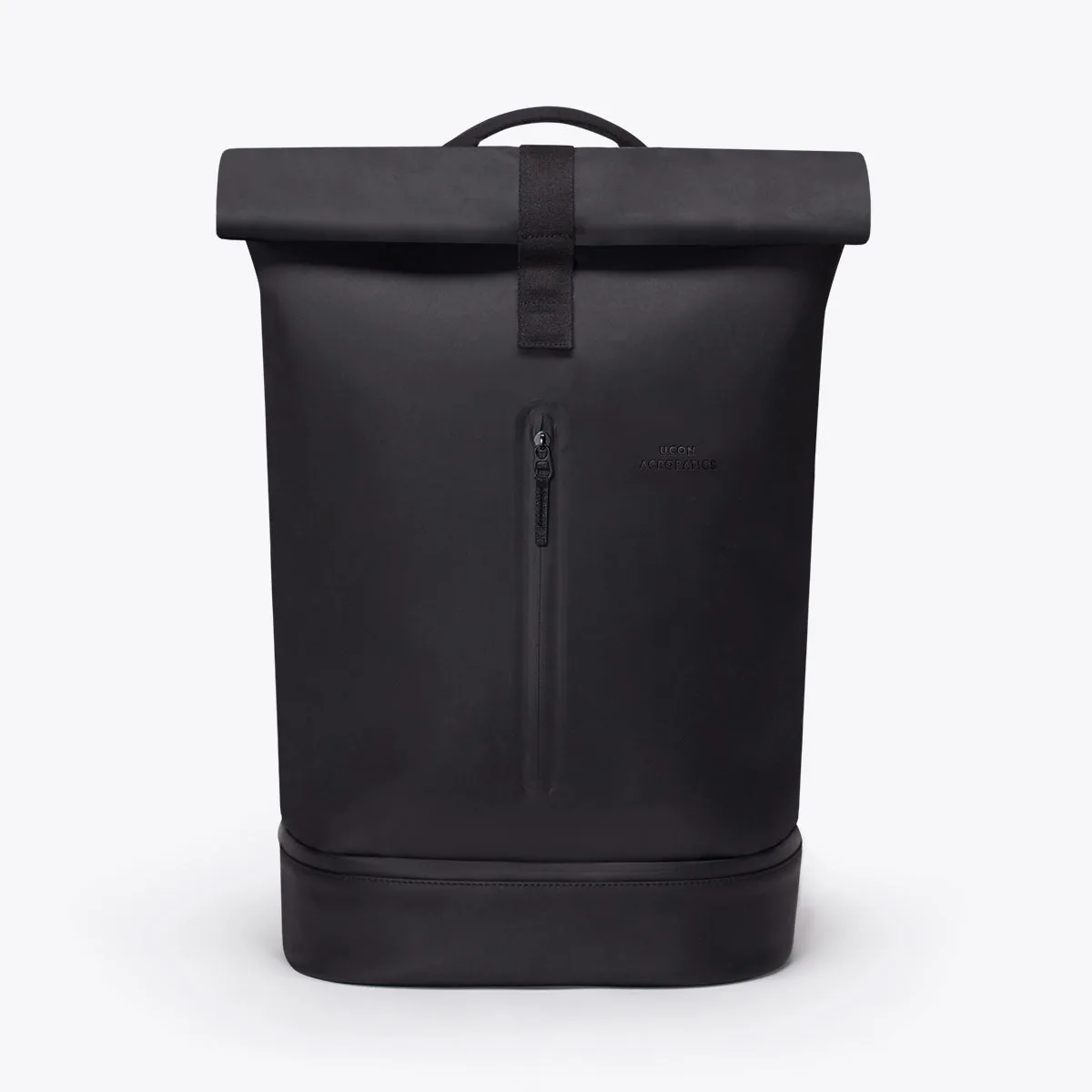 Front view of the Ucon Acrobatics Hajo Pro roll-top backpack in black with the vertical zip of the front pocket